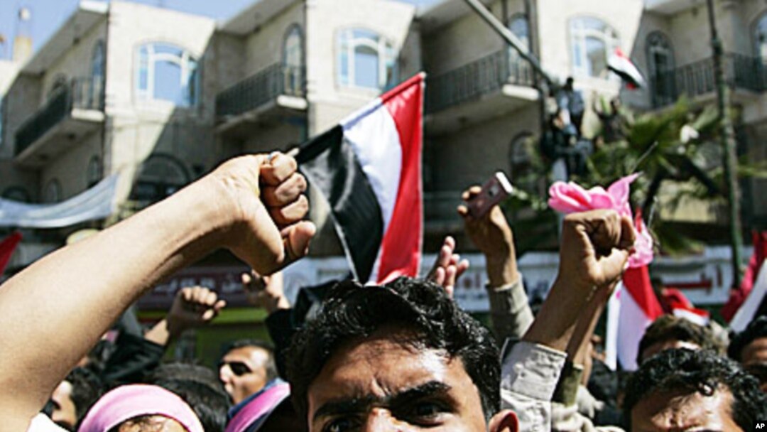 Opposition supporters shout slogans during an anti-government protest in Sana'a, February 3, 2011