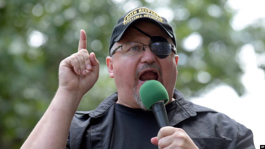FILE - In this June 25, 2017, photo, Stewart Rhodes, founder of the citizen militia group known as the Oath Keepers, speaks during a rally outside the White House in Washington. 