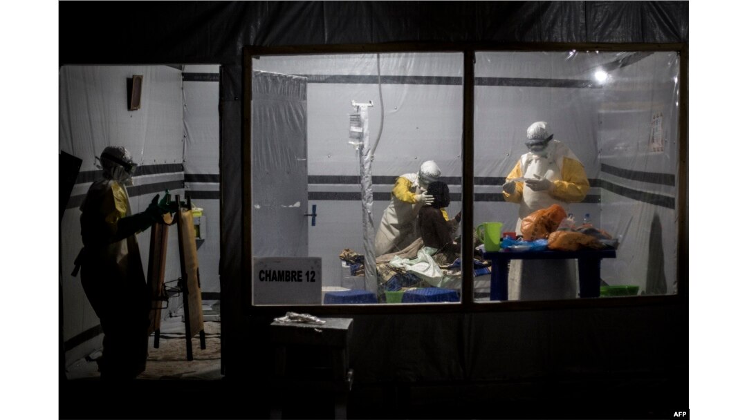 FILE - Health workers treat an unconfirmed Ebola patient, inside a MSF (Doctors Without Borders) supported Ebola Treatment Centre (ETC) in Butembo, Democratic Republic of the Congo, Nov. 3, 2018.