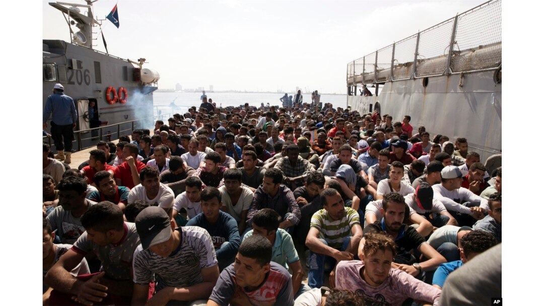 FILE - Migrants are detained at Abosetta base in Tripoli, Libya, May 10, 2017.