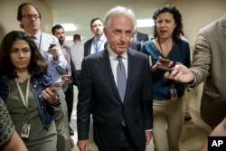 Senate Foreign Relations Committee Chairman Bob Corker, R-Tenn., talks to reporters as he returns to his office from a vote, on Capitol Hill in Washington, Oct. 25, 2017.