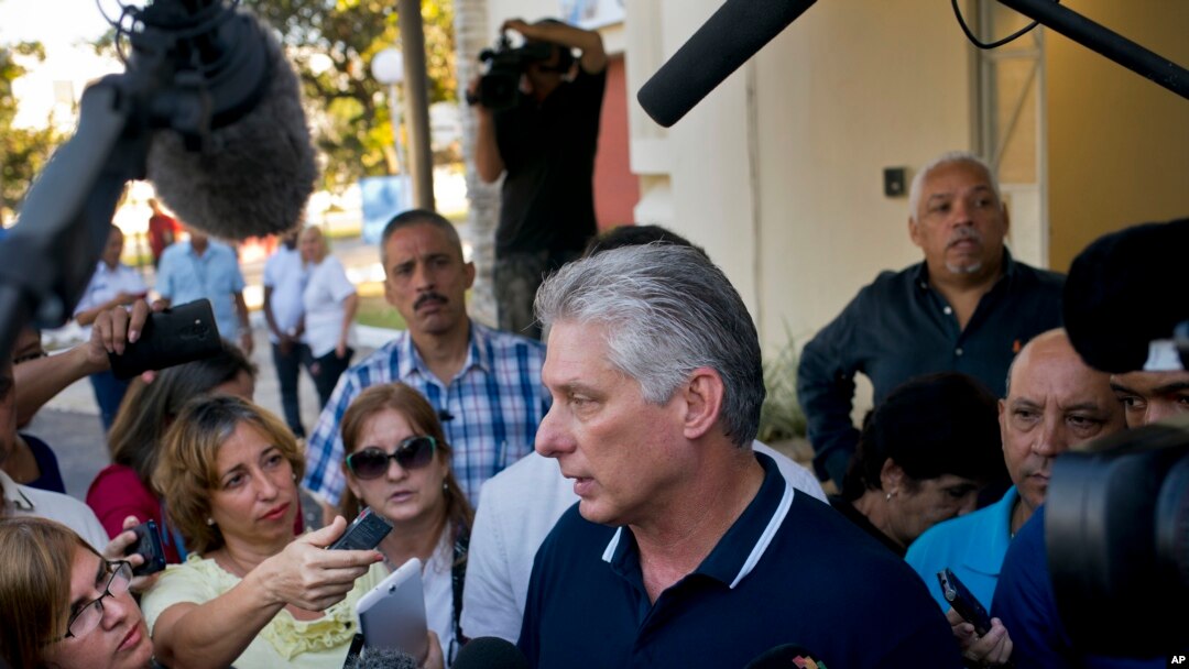 FILE - Cuba's President Miguel Diaz-Canel talks to the press after voting in a referendum to approve or reject the new constitution in Havana, Feb. 24, 2019. 