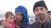 Once a farmer from Mosul, Ibrahim Inaimy (R) fled to the Hassan Sham camp in Iraqi Kurdistan last week, saying Islamic State militants were brutalizing the people as the Iraqi Army recently closed in before taking his area, on Dec. 7, 2016. (H.Murdock/VOA