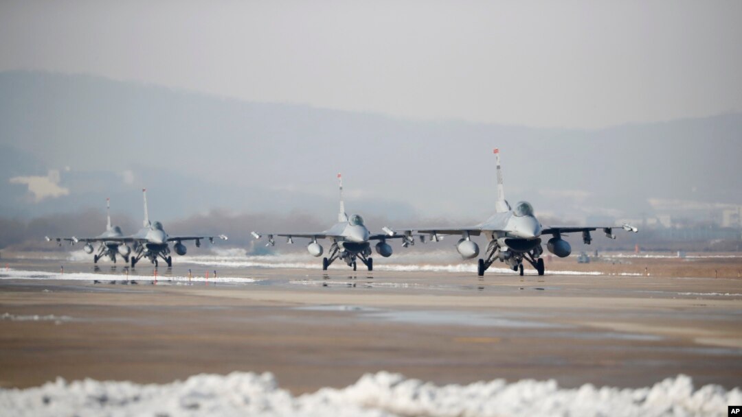FILE - U.S. Air Force F-16 fighter jets take part in a joint aerial drills called Vigilant Ace between U.S and South Korea, at the Osan Air Base in Pyeongtaek, South Korea, Dec. 6, 2017.
