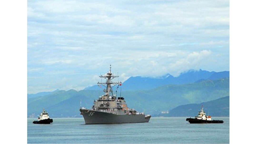 FILE - The guided-missile destroyer USS John S. McCain approaches Da Nang, Vietnam, May 7, 2019.