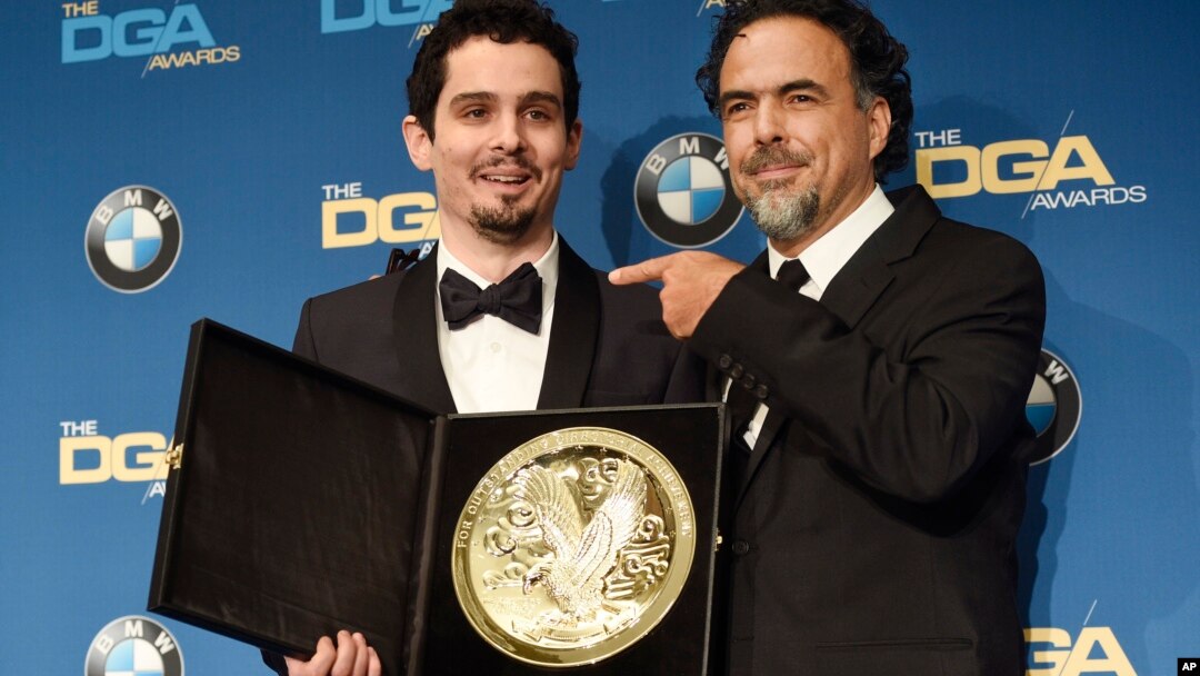 Damien Chazelle, left, director of "La La Land," celebrates his Feature Film Award win with presenter Alejandro Gonzalez Inarritu backstage at the 69th Annual Directors Guild of America Awards at the Beverly Hilton, Feb. 4, 2017, in Beverly Hills, Calif.