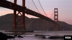Surfers catch waves late in the day at Fort Point beneath the Golden Gate Bridge in San Francisco, Wednesday, Jan. 19, 2011. Sunny conditions and temperatures near 60 are forecast the rest of the week in the Bay area. (AP Photo/Eric Risberg)