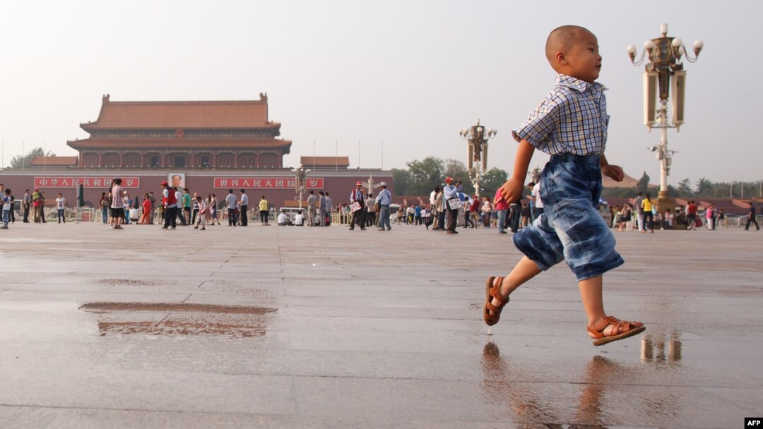 A boy runs on Tiananmen Square in Beijing on June 3, 2012, on the eve of the 23rd anniversary of China's brutal crackdown on democracy protests.