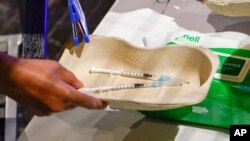 Two doses of the Covid vaccine at Heaven club in London, Aug. 8, 2021. London's Heaven club has become the UK's first nightclub to be turned into a pop-up Covid vaccination center.