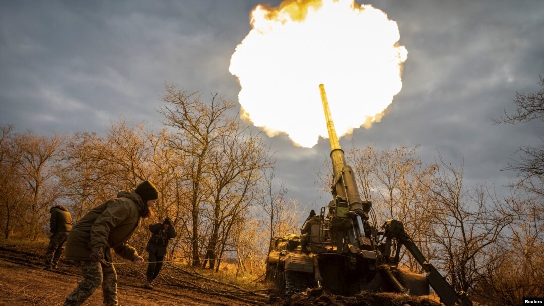 Ukrainian servicemen fire a 2S7 Pion self-propelled gun at a position on a frontline in Kherson region