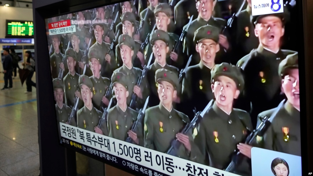 A TV screen shows file images of North Korean soldiers during a news program at Seoul Railway Station in Seoul, South Korea, Oct. 18, 2024. 