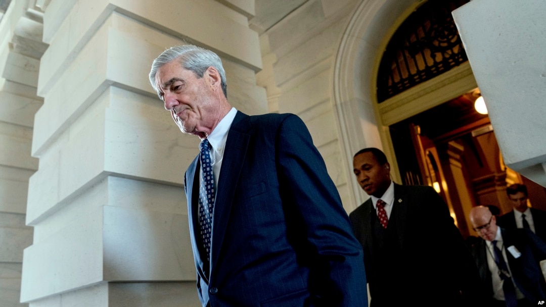 FILE - Former FBI Director Robert Mueller, the special counsel probing Russian interference in the 2016 election, departs Capitol Hill following a closed door meeting in Washington, June 21, 2017. 
