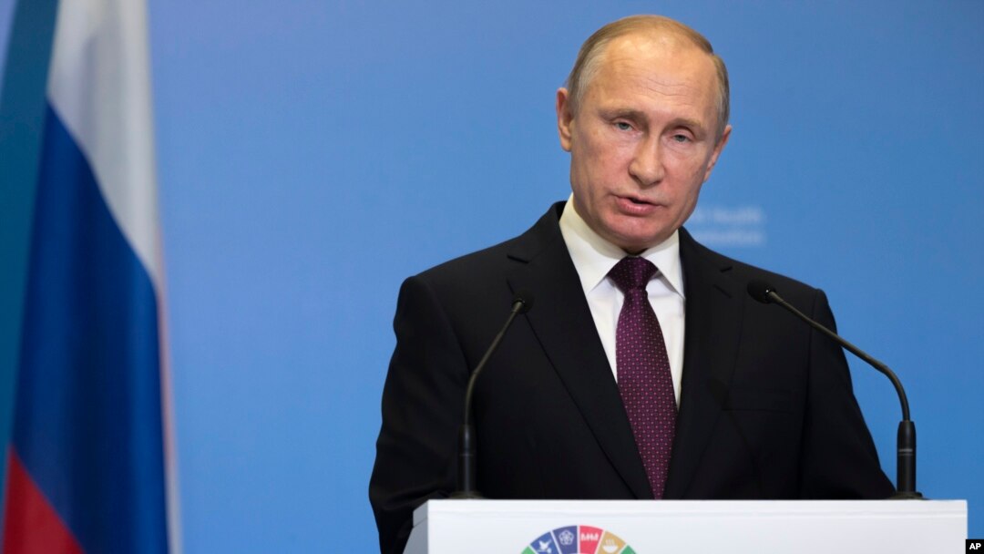 FILE - Russian President Vladimir Putin delivers his speech attending the World Health OrganiZation ministerial conference in Moscow, Russia, Nov. 16, 2017. 