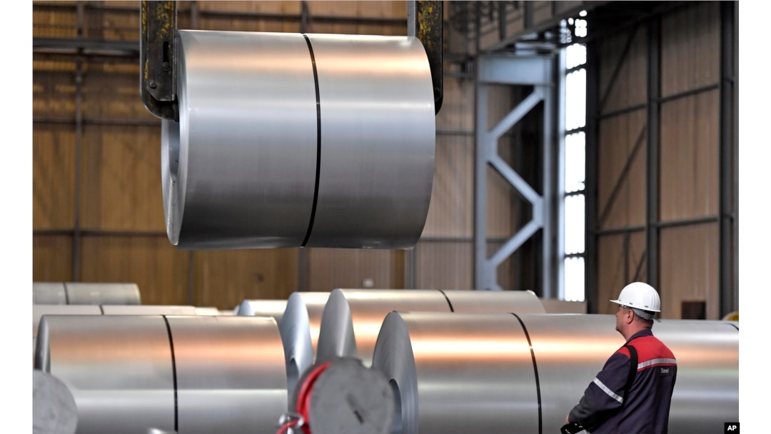 FILE - A worker moves steel coils at the Thyssenkrupp steel factory in Duisburg, Germany, April 27, 2018. German reaction to the announcement of U.S. tariffs being placed on steel and aluminum imports was among the fiercest in Europe.