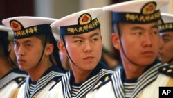 FILE - A military honor guard prepares for U.S. Chief of Naval Operations Admiral Jonathan Greenert's visit with Commander in Chief of the PLA Navy Adm. Wu Shengli at a welcoming ceremony at the PLA Navy headquarters outside Beijing, China, July 15, 2014.