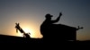 FILE - A member of the Iraqi forces flashes the V for victory sign during military operations in the south and west of the northern Iraqi city of Mosul in search of Islamic State militants, July 11, 2021. 