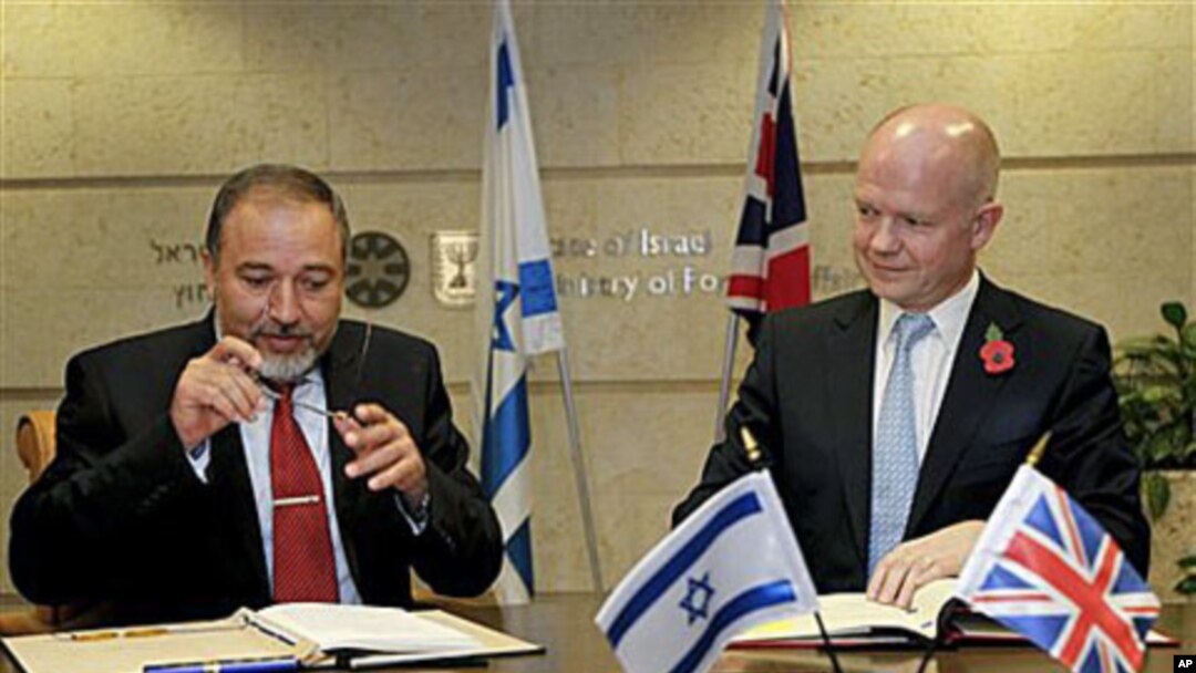 British Foreign Secretary William Hague, right, meets with his Israeli counterpart Avigdor Lieberman as they prepare to sign an agreement which will increase cooperation between the two countries' film industries, in Jerusalem, 3 Nov 2010