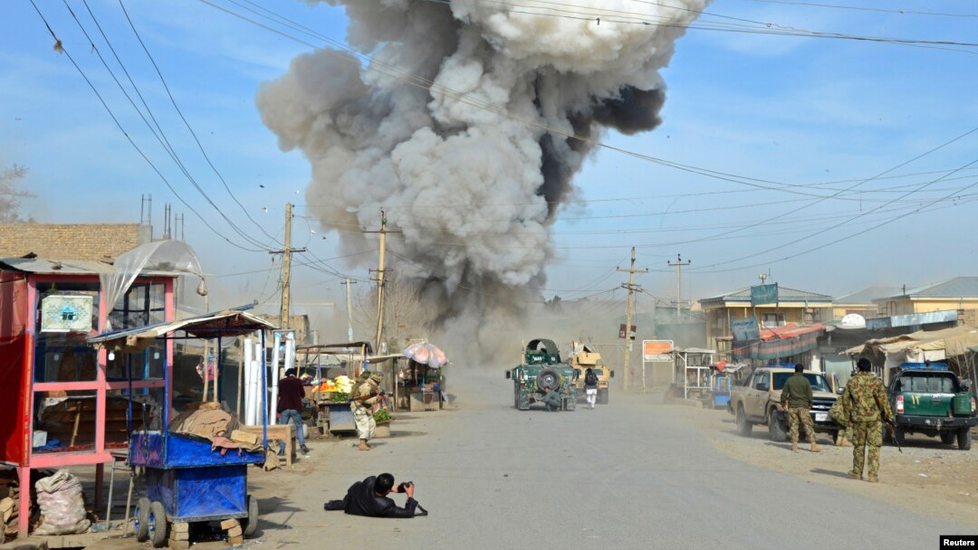 Smoke rises in the sky after a suicide car bomb attack in Kunduz province, February 10, 2015.