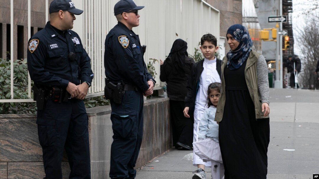 Worshippers arrive for service at the Islamic Cultural Center of New York under increased police security following the shooting in New Zealand, March 15, 2019, in New York. 