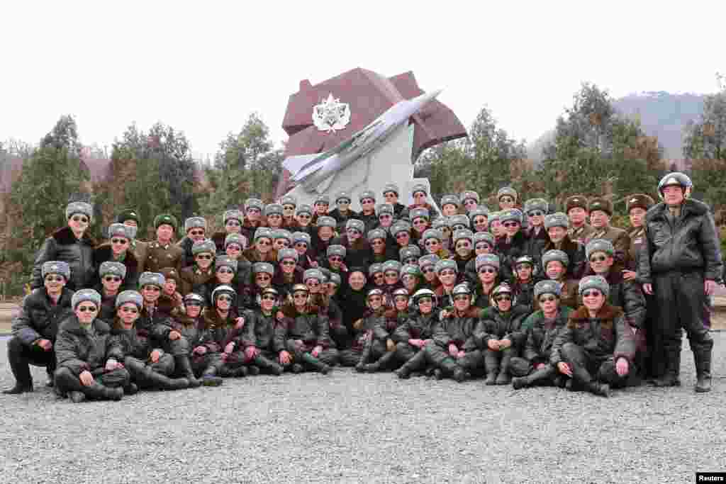 North Korean leader Kim Jong Un (center) visits Unit 447 of the Korean People's Army (KPA) Air 7th Regimen in this undated photo released by North Korea's Korean Central News Agency (KCNA) in Pyongyang, March 3, 2015.