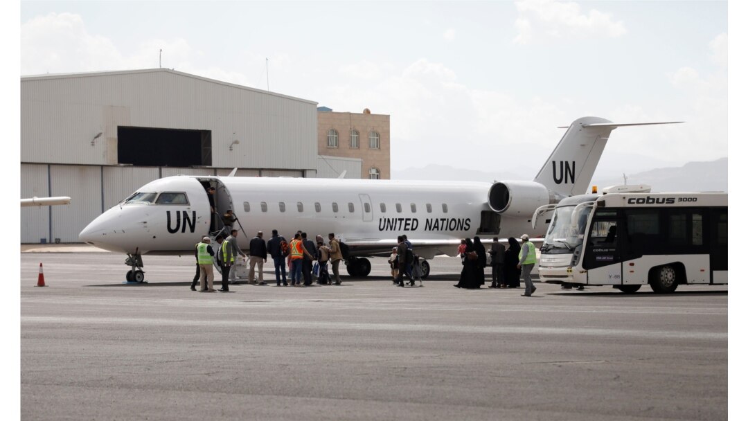 Yemenis board a United Nation plane at Sana'a International airport, Yemen, Feb. 3, 2020. The United Nations medical relief flight carrying patients from Yemen's rebel-held capital was the first in over three years.