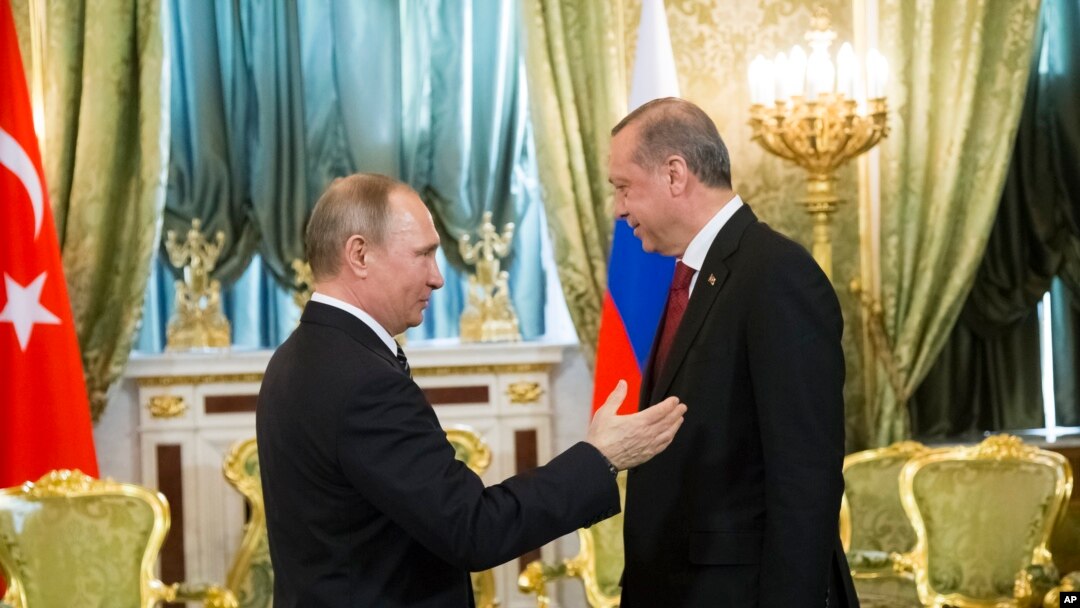 FILE - Russian President Vladimir Putin, left, speaks to Turkey's President Recep Tayyip Erdogan during their meeting in the Kremlin in Moscow, Russia, March 10, 2017. 
