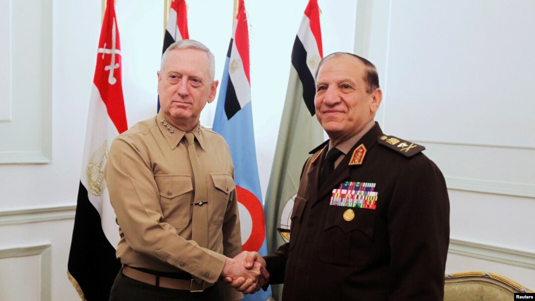 FILE - Egypt's Chief of Staff of the Armed Forces Sami Anan, right, shakes hands with the U.S. Commander of the Central Command James Mattis during a meeting in Cairo, Egypt, March 29, 2011. Anan announced his candidacy for president of Egypt on Saturday.