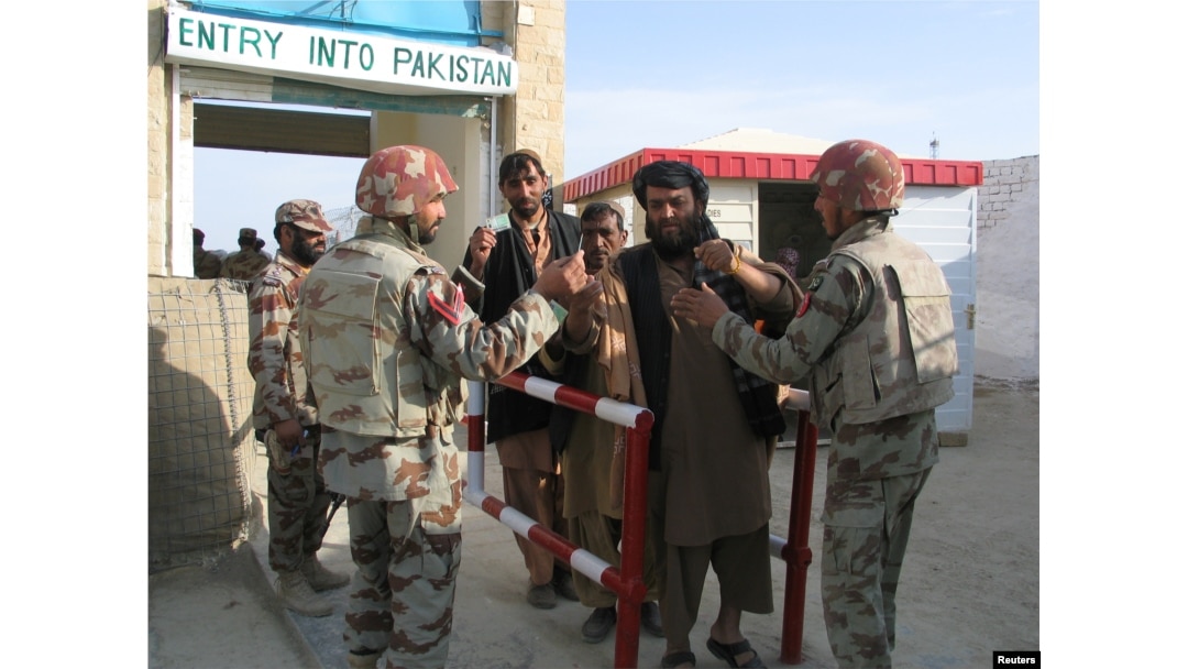 Pakistani soldiers check the identity of citizens returning from Afghanistan at the border town of Chaman, Pakistan, March 7, 2017.