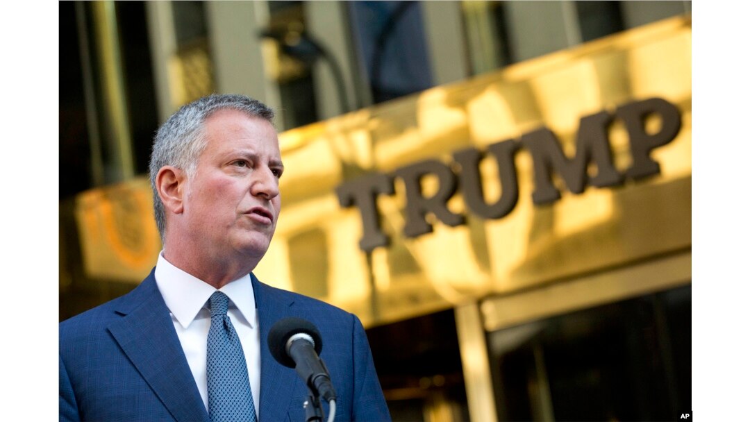 FILE -New York Mayor Bill de Blasio holds a news conference in front of Trump Tower following a meeting with President-elect Donald Trump, Nov. 16, 2016, in New York.