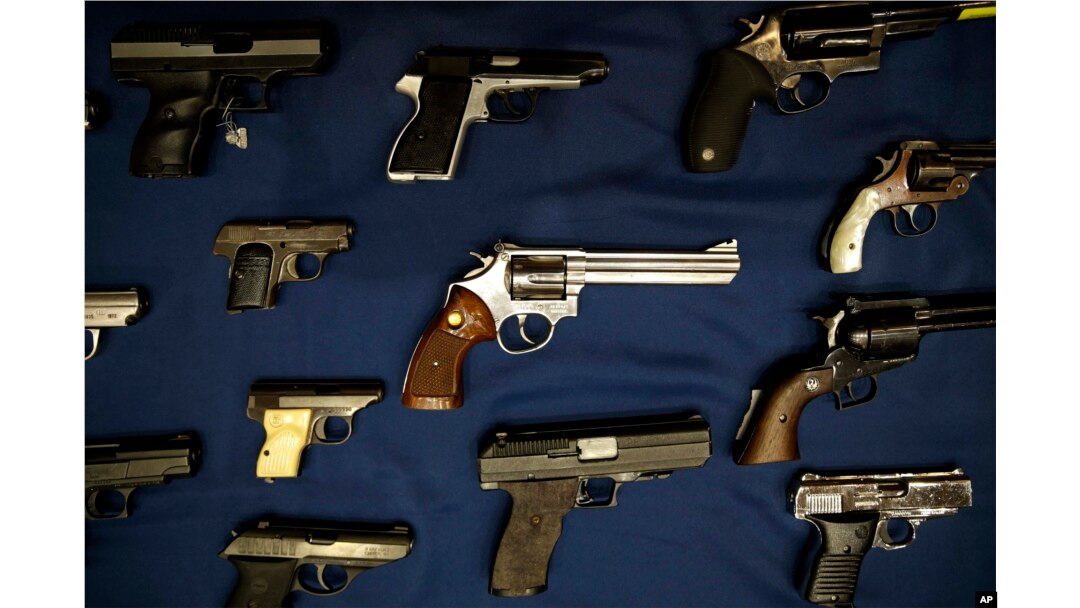 FILE - Guns seized by the police are displayed during a news conference in New York.