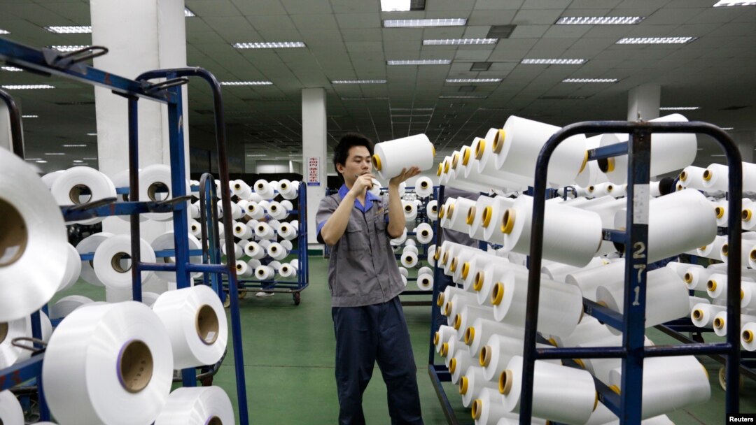 An employee works inside a textile mill in Yiwu, Zhejiang province.