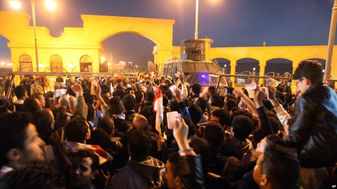 Fans of Egypt's Zamalek soccer team flock in droves outside the Air Defense Stadium to watch a match between Egyptian Premier League clubs Zamalek and ENPPI in a suburb east of Cairo, Egypt, Sunday, Feb. 8, 2015.