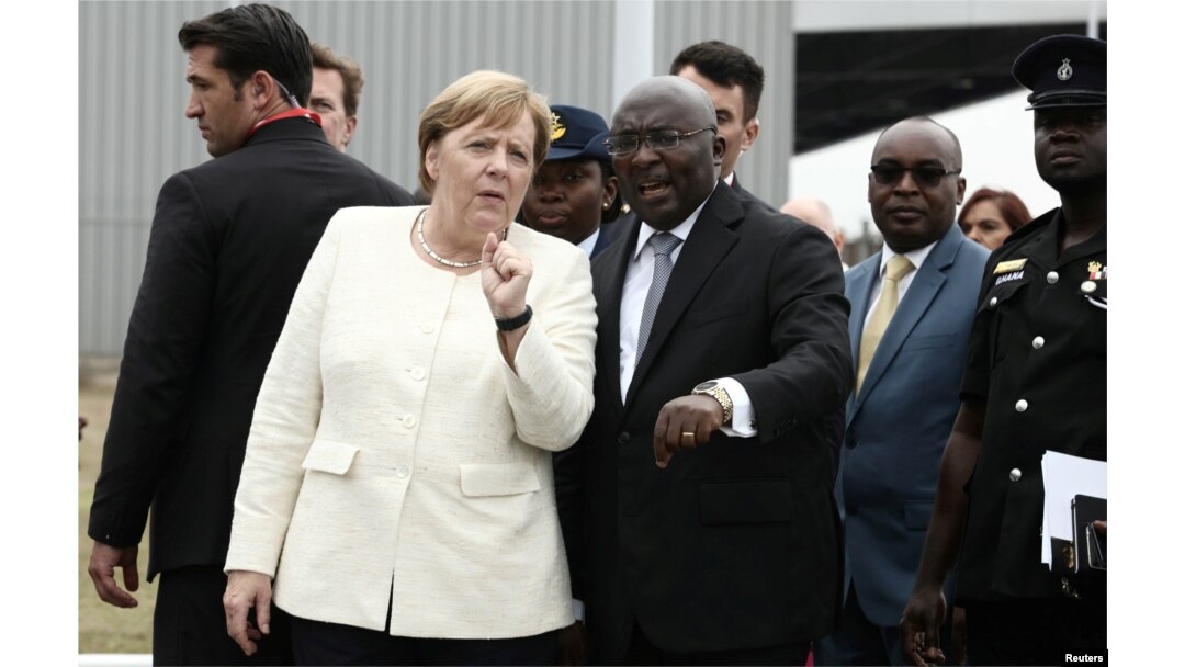 FILE - German Chancellor Angela Merkel is welcomed by Ghana's Vice President Bawumia at the Jubilee Airport in Accra, Ghana, Aug. 30, 2018.