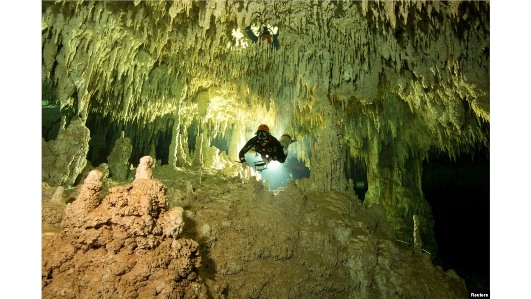 A scuba diver measures the length of Sac Aktun underwater cave system as part of the Gran Acuifero Maya Project near Tulum, in Quintana Roo state, Mexico, Jan. 24, 2014.