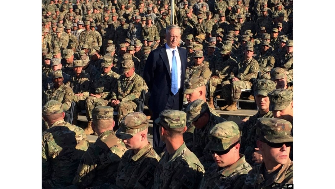 FILE - Then-Defense Secretary Jim Mattis talks to U.S. troops at Guantanamo Bay, Cuba, Dec. 21, 2017.