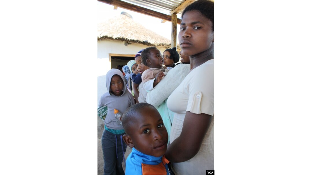 Patients wait to see the nurse inside the health point at Masizini (D. Taylor/VOA)