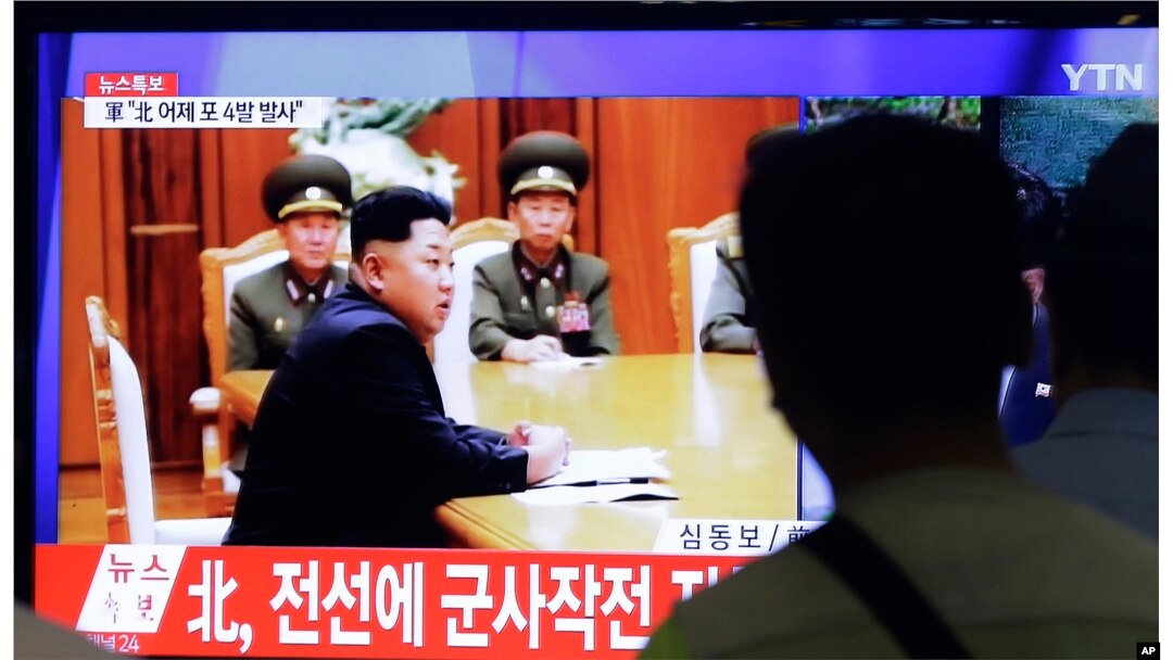 FILE - South Koreans watch television images showing North Korean leader Kim Jong Un, at a train station in Seoul, South Korea, Aug. 21, 2015.