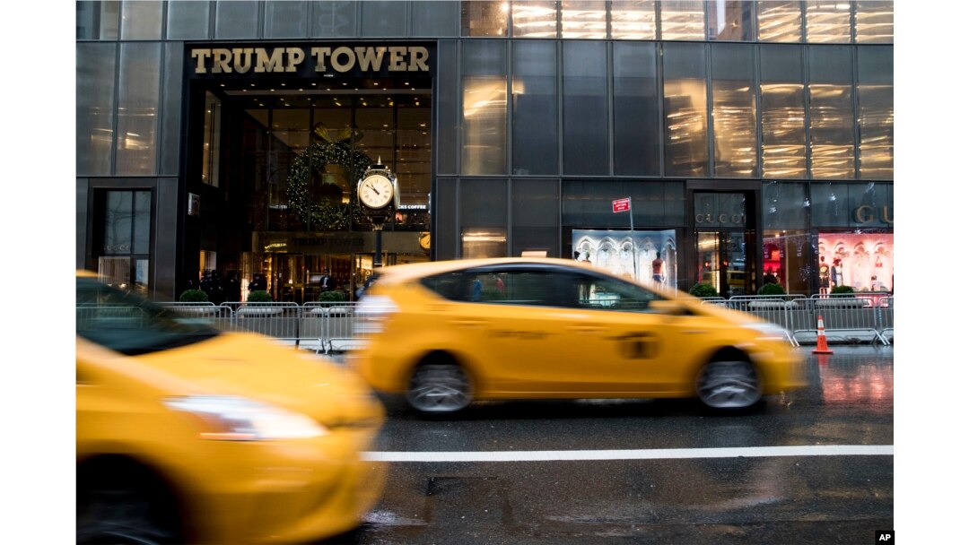 Traffic makes it's way down Fifth Avenue past Trump Tower, Nov. 29, 2016, in New York.