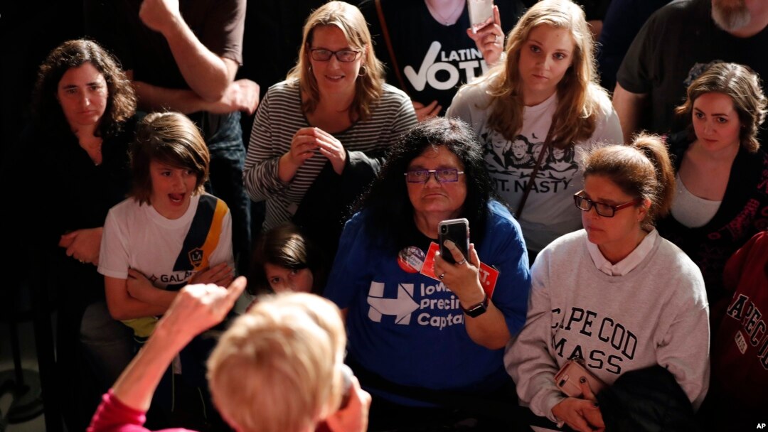 The crowd listens as Sen. Elizabeth Warren, D-Mass, speaks during an organizing event at Curate event space in Des Moines, Iowa, Jan. 5, 2019.