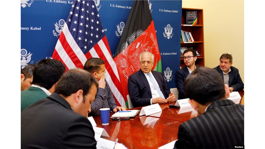 FILE - U.S. special envoy for peace in Afghanistan, Zalmay Khalilzad, center, speaks during a roundtable discussion with Afghan media at the U.S Embassy in Kabul, Jan. 28, 2019. (U.S Embassy/ Handout via Reuters)