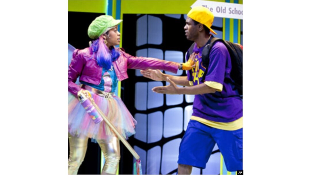 The Graffiti Fairy (Paige Hernandez) confronts P. Nokio (Psalmayene 24) in a scene from Imagination Stage's hip hop retelling of "Pinocchio."