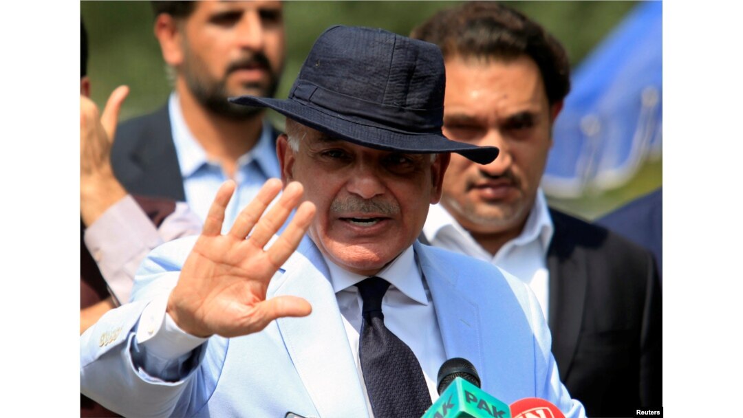 FILE - Shahbaz Sharif, chief minister of Punjab Province and brother of Pakistan's former Prime Minister Nawaz Sharif, gestures after appearing before a Joint Investigation Team in Islamabad, Pakistan, June 17, 2017.