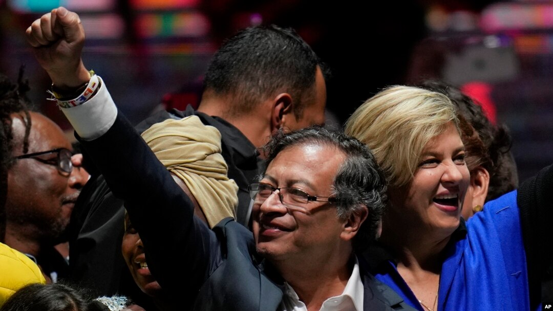 Former rebel Gustavo Petro and his wife Veronica Alcocer celebrate before supporters after winning a runoff presidential election in Bogota, Colombia, June 19, 2022.