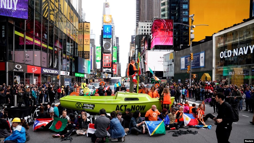 Climate activists participate in an Extinction Rebellion protest in New York, Oct. 10, 2019.