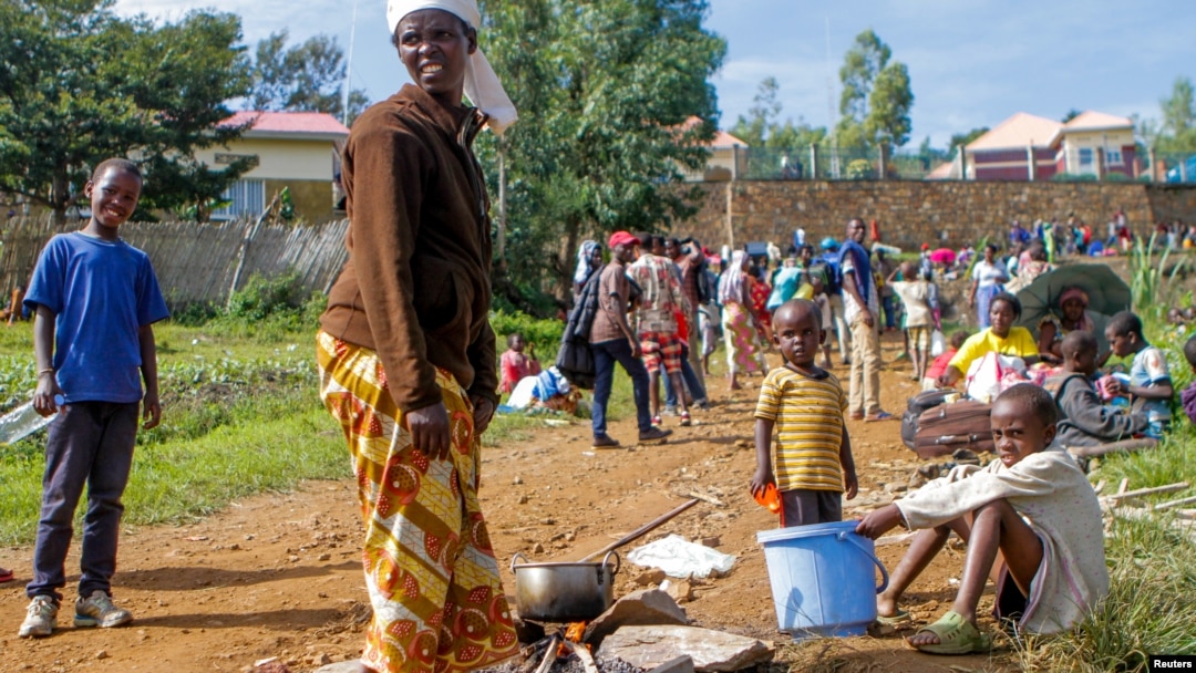 A refugee from the Democratic Republic of Congo is seen with her children near the United Nations High Commissioner for Refugees (UNHCR) offices in Kiziba refugee camp in Karongi District, Rwanda, Feb. 21, 2018.