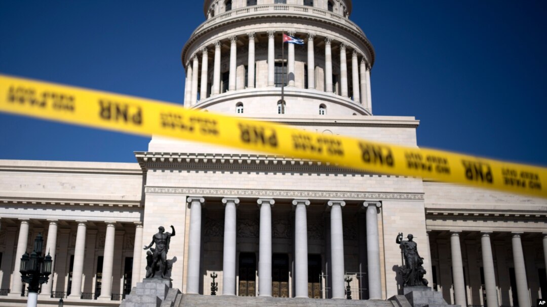 Caution tape blocks the street at the entrance of the National Capitol building in Havana, Cuba, July 13, 2021. 