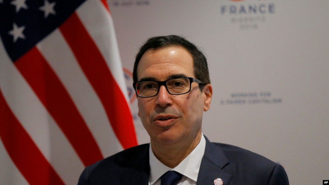 FILE - U.S. Treasury Secretary Steve Mnuchin answers reporters after the G-7 Finance, July 18, 2019 in Chantilly, north of Paris, France.