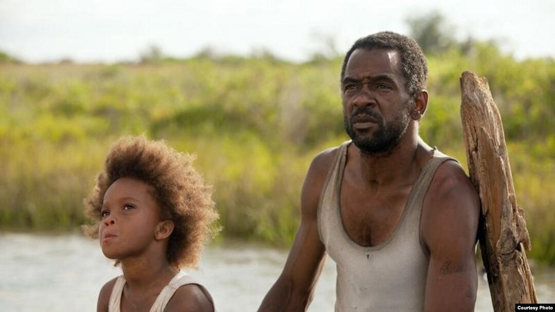 Quvenzhane Wallis as "Hushpuppy" and Dwight Henry as "Wink" on the set of Beasts of The Southern Wild (Photo: Fox Searchlight / Mary Cybulski)