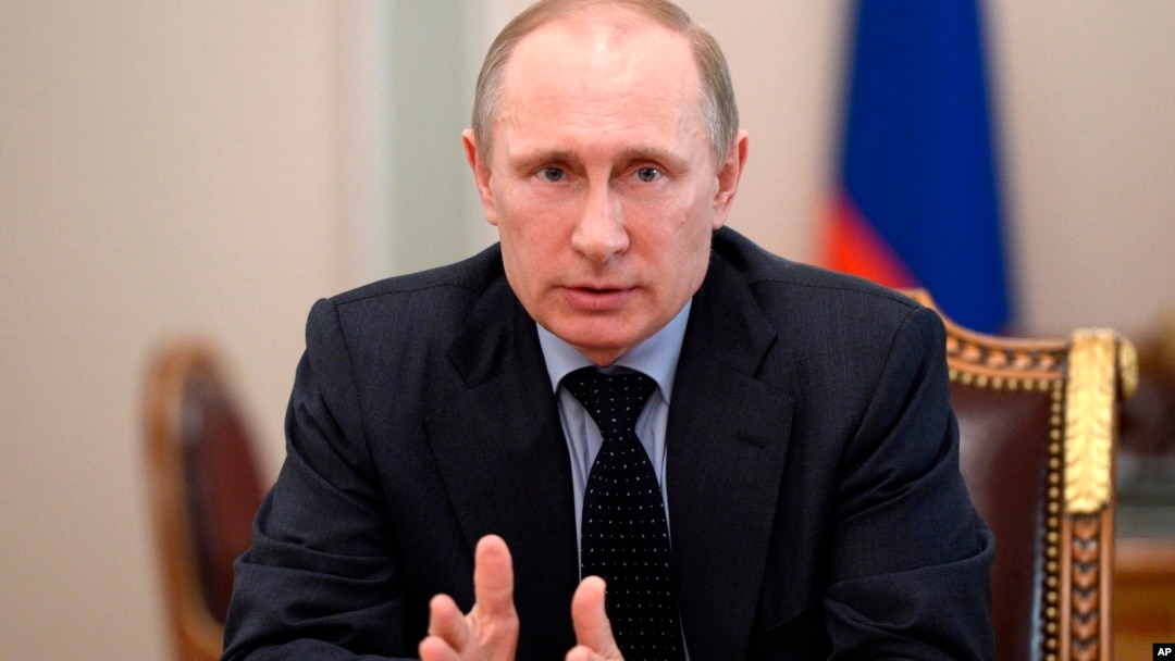 Russian President Vladimir Putin speaks at a Security Council meeting at the Kremlin in Moscow, Russia, March 28, 2014.