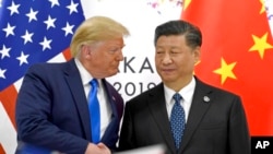 资料照片:美国总统特朗普与中国国家主席习近平在大阪20国集团峰会期间会面。(2019年6月19日)